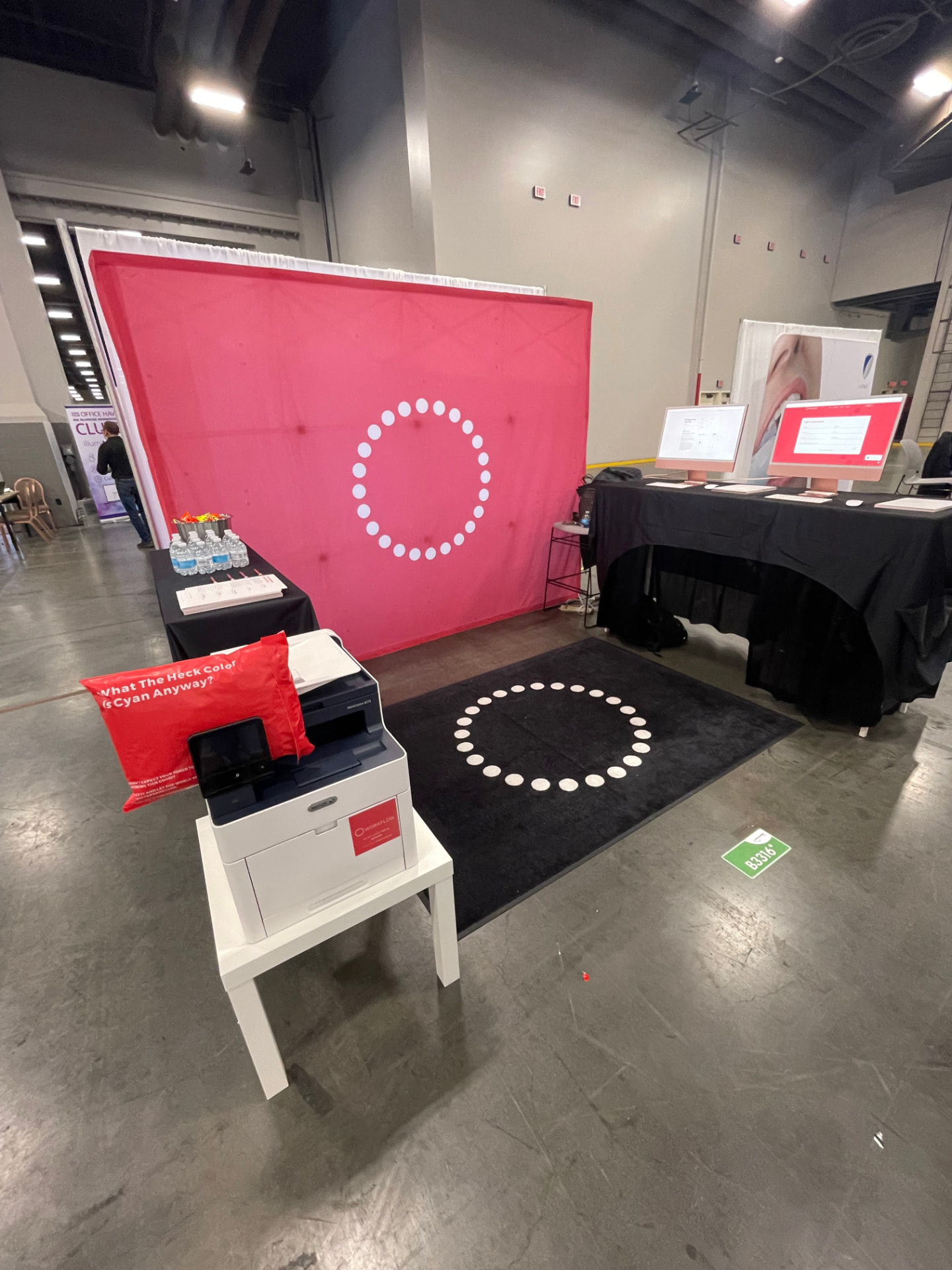 Workflow Group branded trade-show booth with managed print equipment