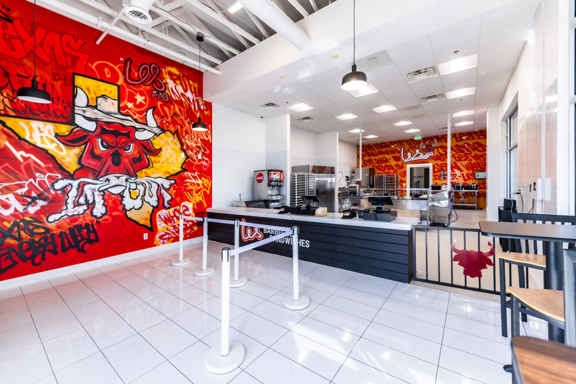Les Barbecue Sandwiches restaurant interior with graffiti mural