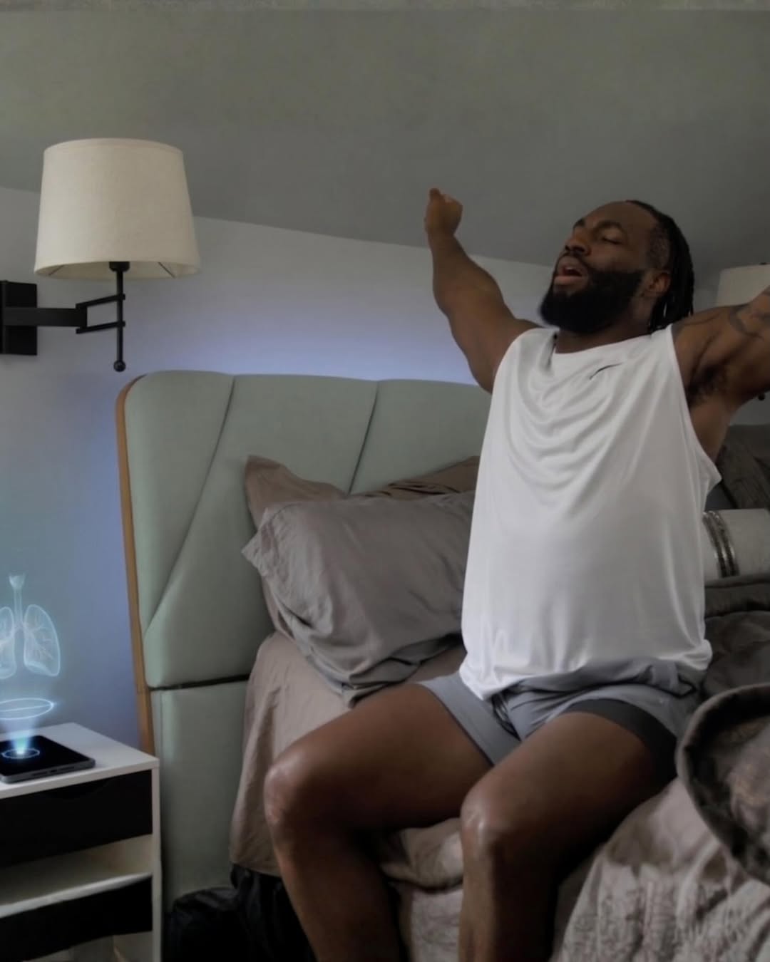 Athlete stretching at home with a holographic health display